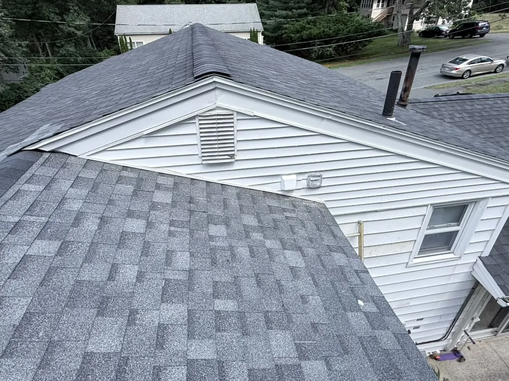 New shingle roof over the addition, tying into the original roofline