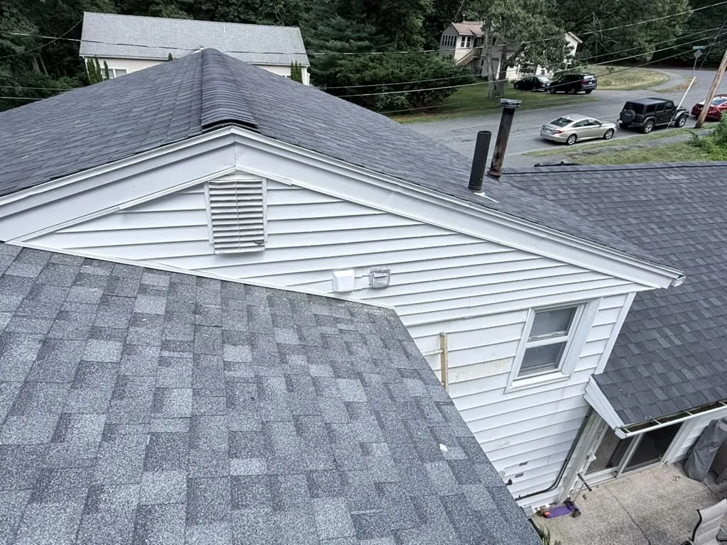The finished roof and gable of the addition seen from above, with the vent and trim in place